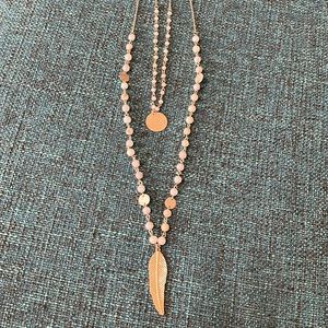 Adjustable to strand beaded necklace with leaf and dome. Adjustable 19-16 inches